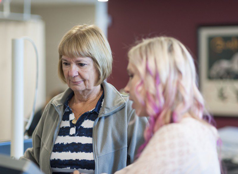 physiotherapist talking to patient