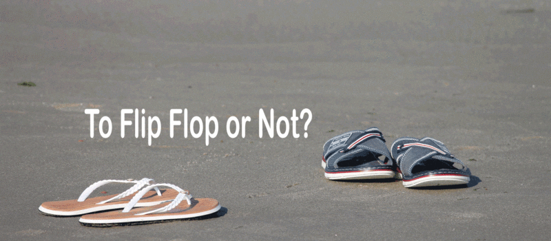 image of two pairs of flip flops or sandals on the beach